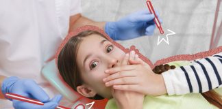 Criança com medo de dentista no consultório